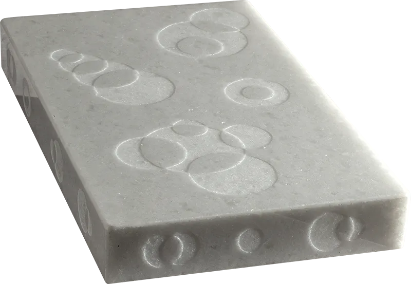 Connessioni Concentriche, natural state — intersecting concentric circles engraved in crystalline marble